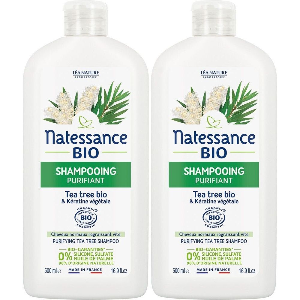 Twee witte shampoo flessen met groene etiketten. Opschrift: Natessance BIO Shampooing Purifiant Tea Tree Bio.