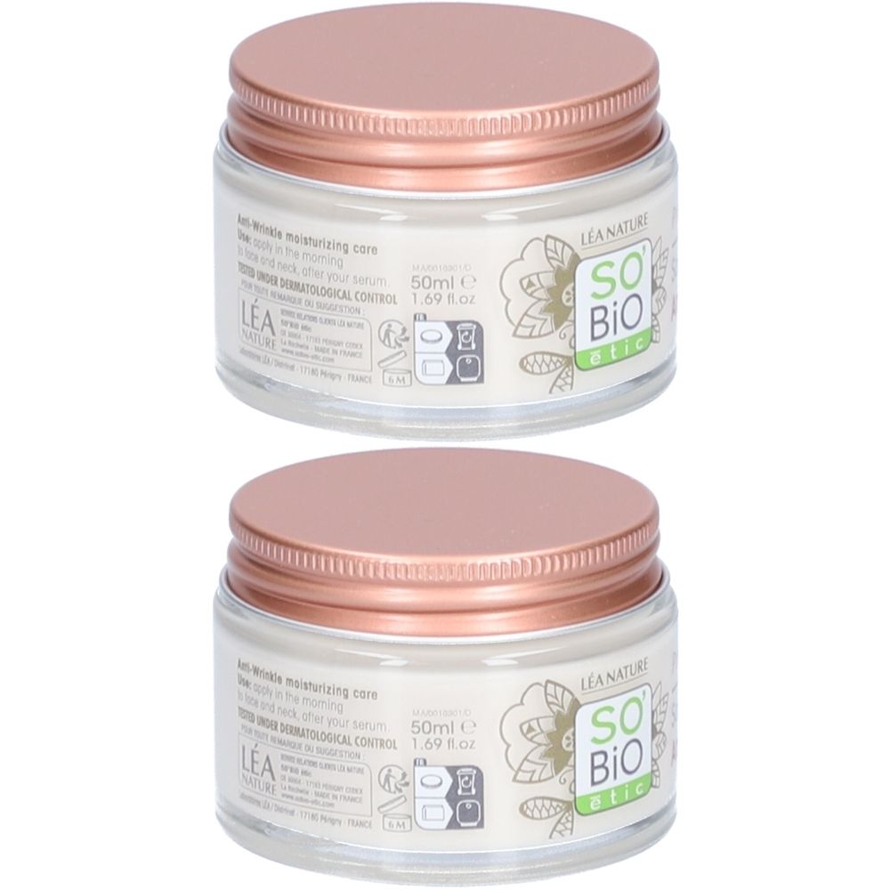 Twee potten met roze deksels. Opschrift SO BIO etic. Glazen potten met witte inhoud.