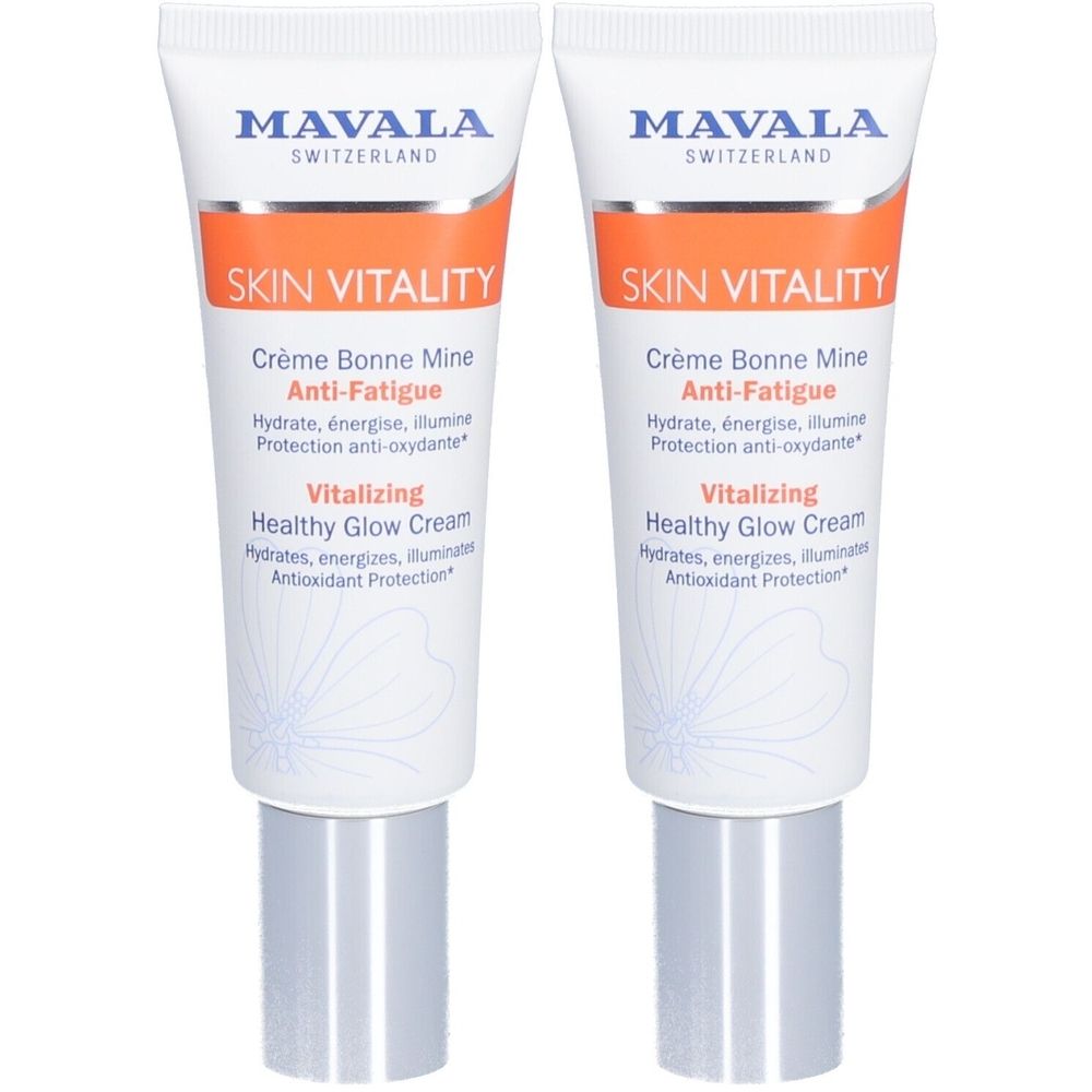 Twee tubes SKIN VITALITY crème. Witte achtergrond, oranje band. Opschriften: Crème Bonne Mine Anti-Fatigue, Vitalizing Healthy Glow Cream.