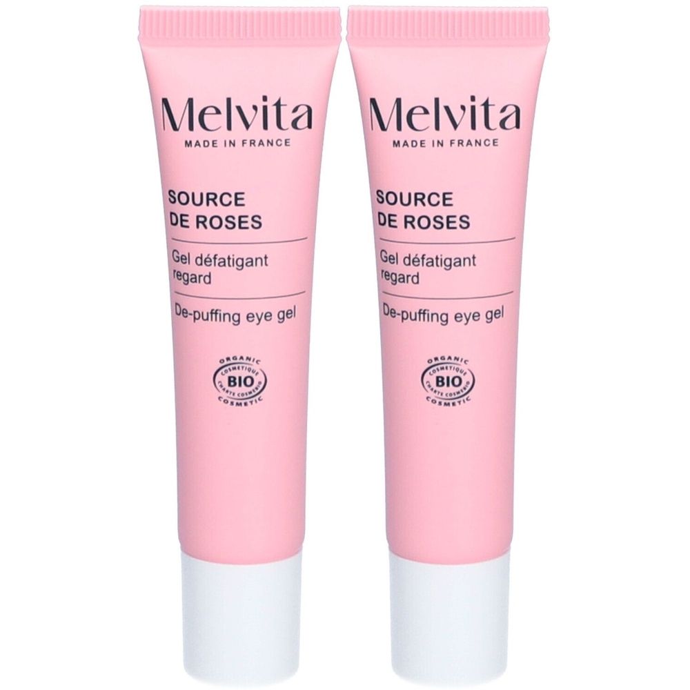 Deux tubes roses avec bouchon blanc. Inscription: Melvita, Source de Roses, Gel défatigant regard, De-puffing eye gel. Label Bio.