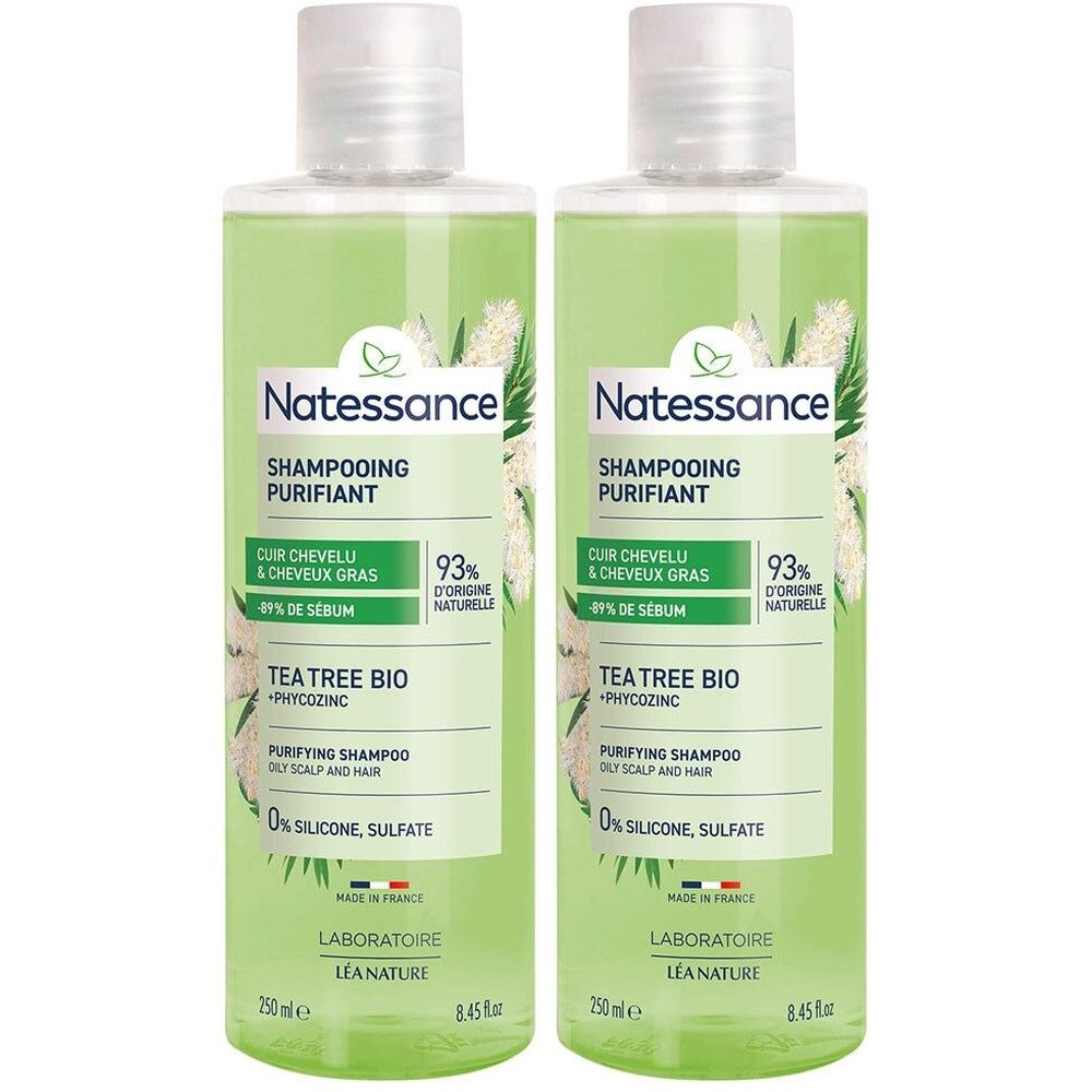 Deux flacons de shampooing vert avec bouchon blanc. Inscription: Natessance, Shampooing Purifiant, Tea Tree Bio. Inscriptions en français.