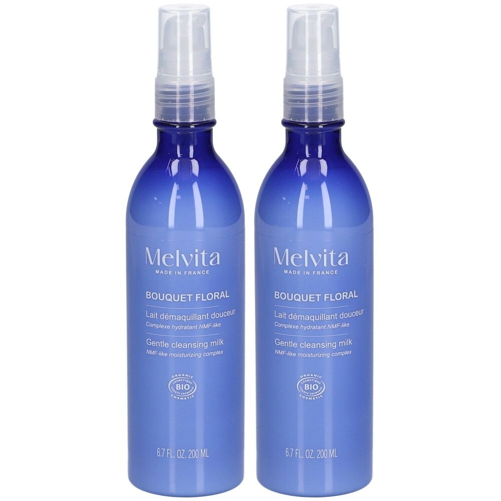Deux flacons bleus avec vaporisateur. Inscriptions: Melvita, Bouquet Floral, Lait démaquillant douceur, Gentle cleansing milk. Certification Bio.