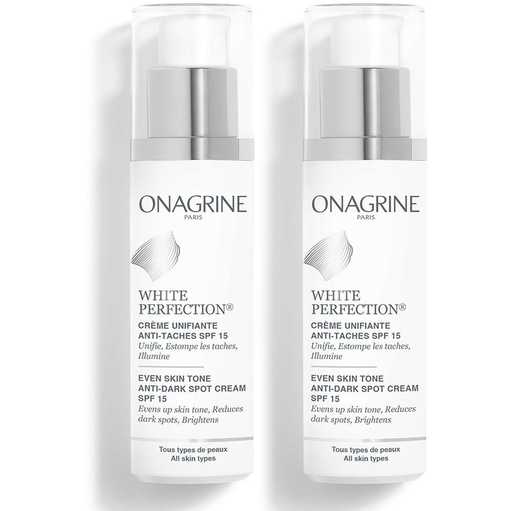 Twee witte flacons met zilveren pompkopjes. Opschrift: ONAGRINE, White Perfection Crème Unifiante Anti-Taches SPF 15. Voor alle huidtypes.