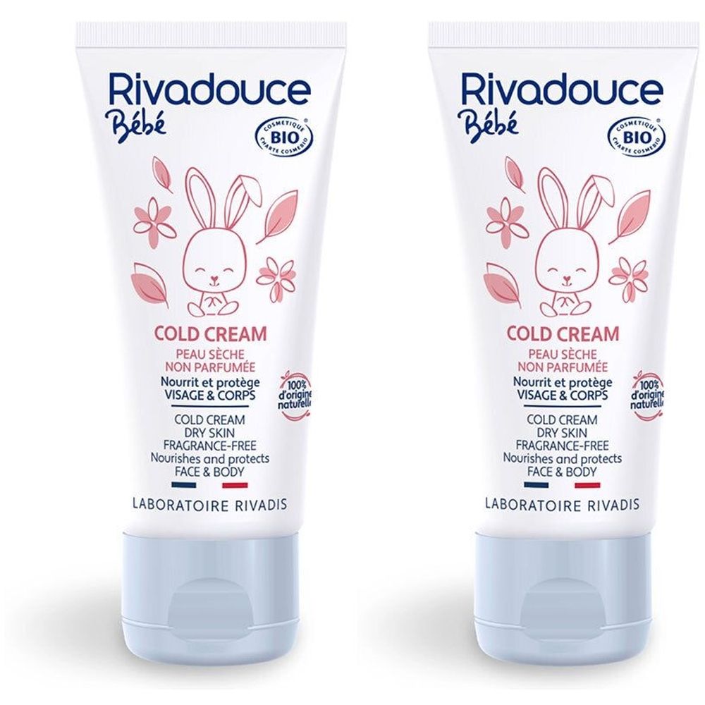 Twee tubes Rivadouce Bébé Cold Cream. Witte tubes met blauwe dop. Bedrukt met logo, konijn, bloemen en tekst.