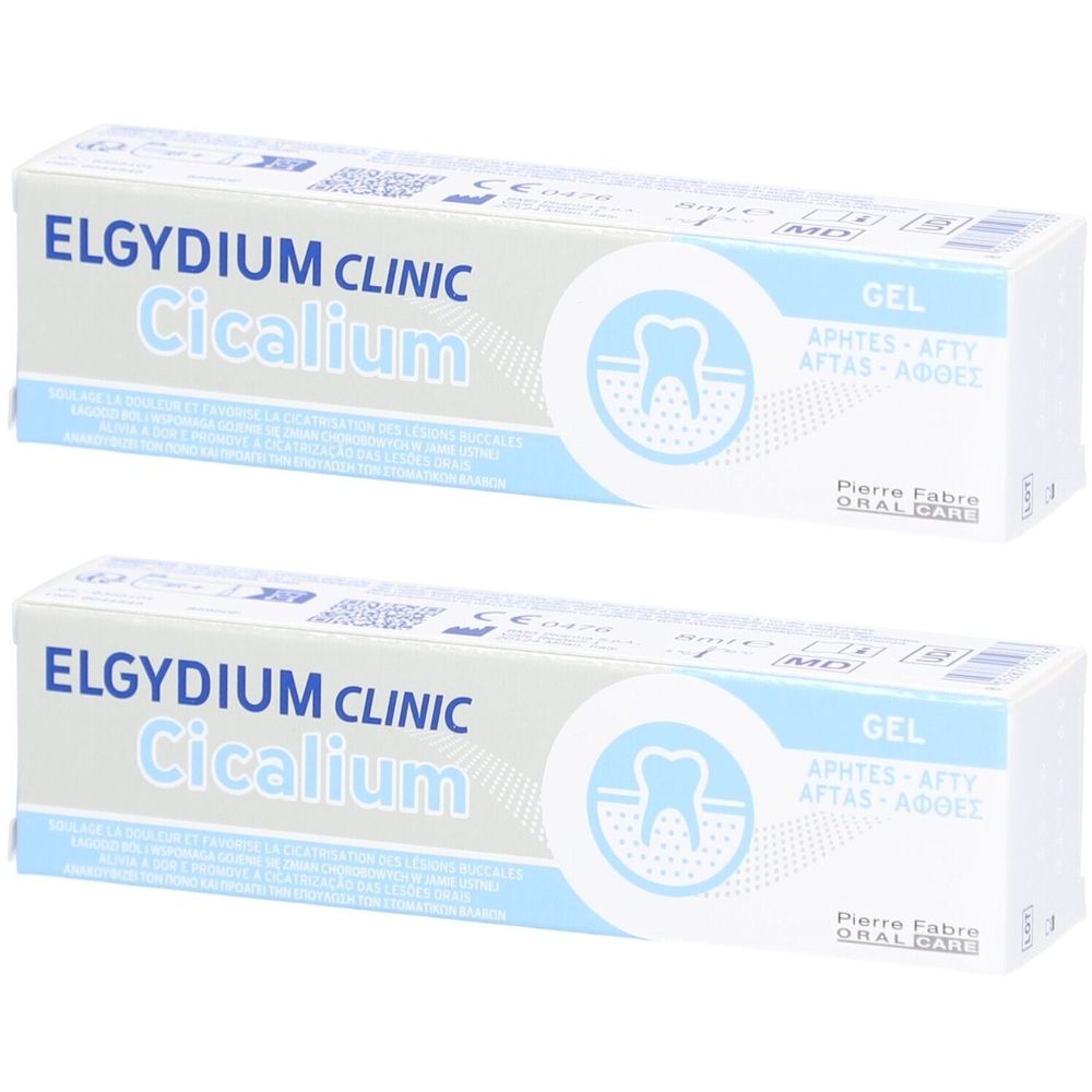 Twee tubes Elgydium Clinic Cicalium gel. Witte verpakking met blauwe tekst en tand-symbool. Bevat informatie in meerdere talen.