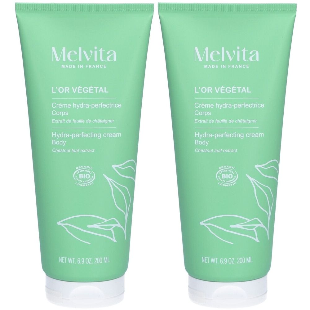 Twee groene tubes met witte dop. Opschrift: Melvita, L'Or Végétal, Crème hydra-perfectrice Corps, BIO-label.