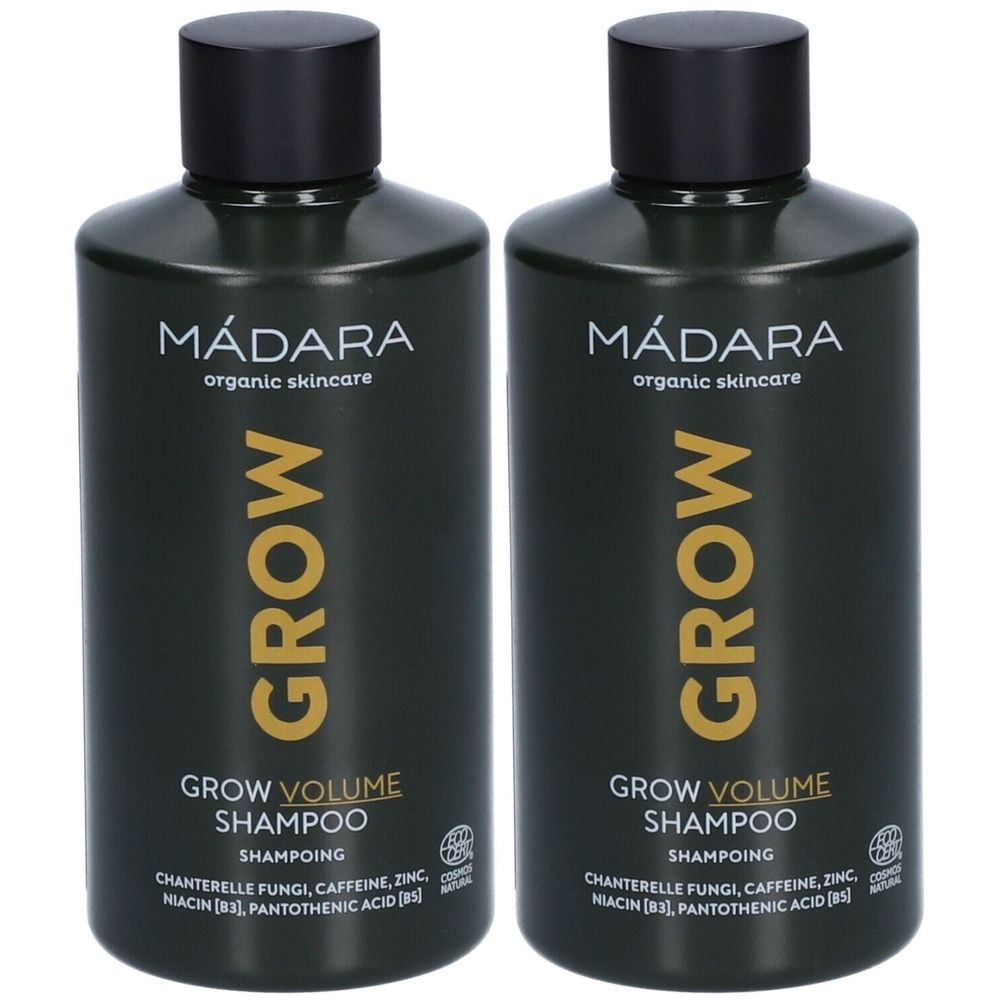 Twee flessen Mádara Grow Volume Shampoo. Donkergroene flessen met zwarte dop. Opschrift: Grow Volume Shampoo.