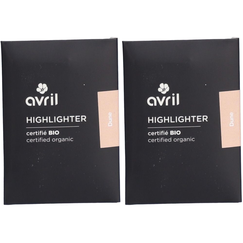 Twee verpakkingen van Avril Highlighter Düne. Zwarte dozen met witte tekst. Gecertificeerd biologisch product. Beige sticker.