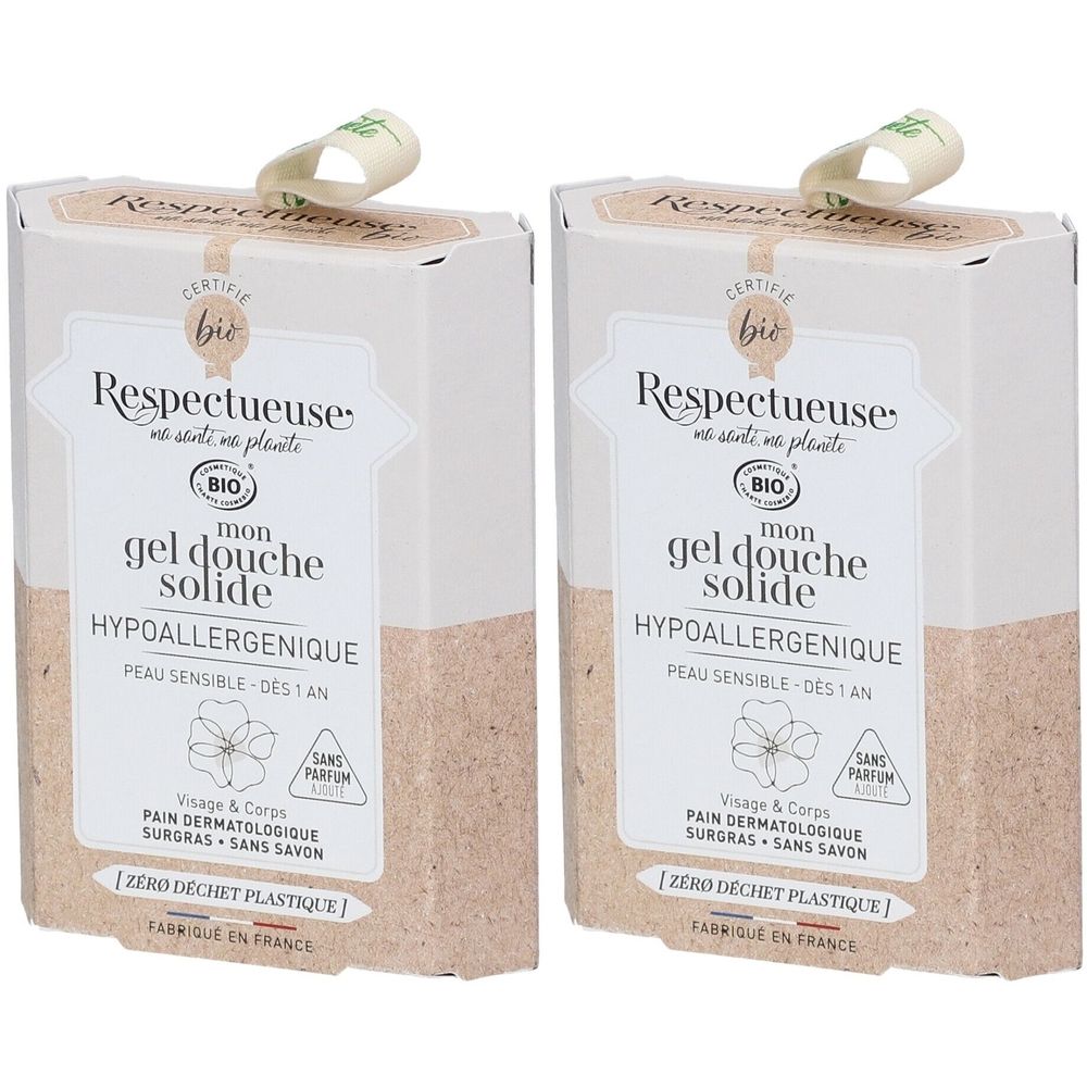 Deux boîtes rectangulaires de gel douche solide Respectueuse. Inscription: hypoallergénique, peau sensible. Certifié bio. Ruban en haut.