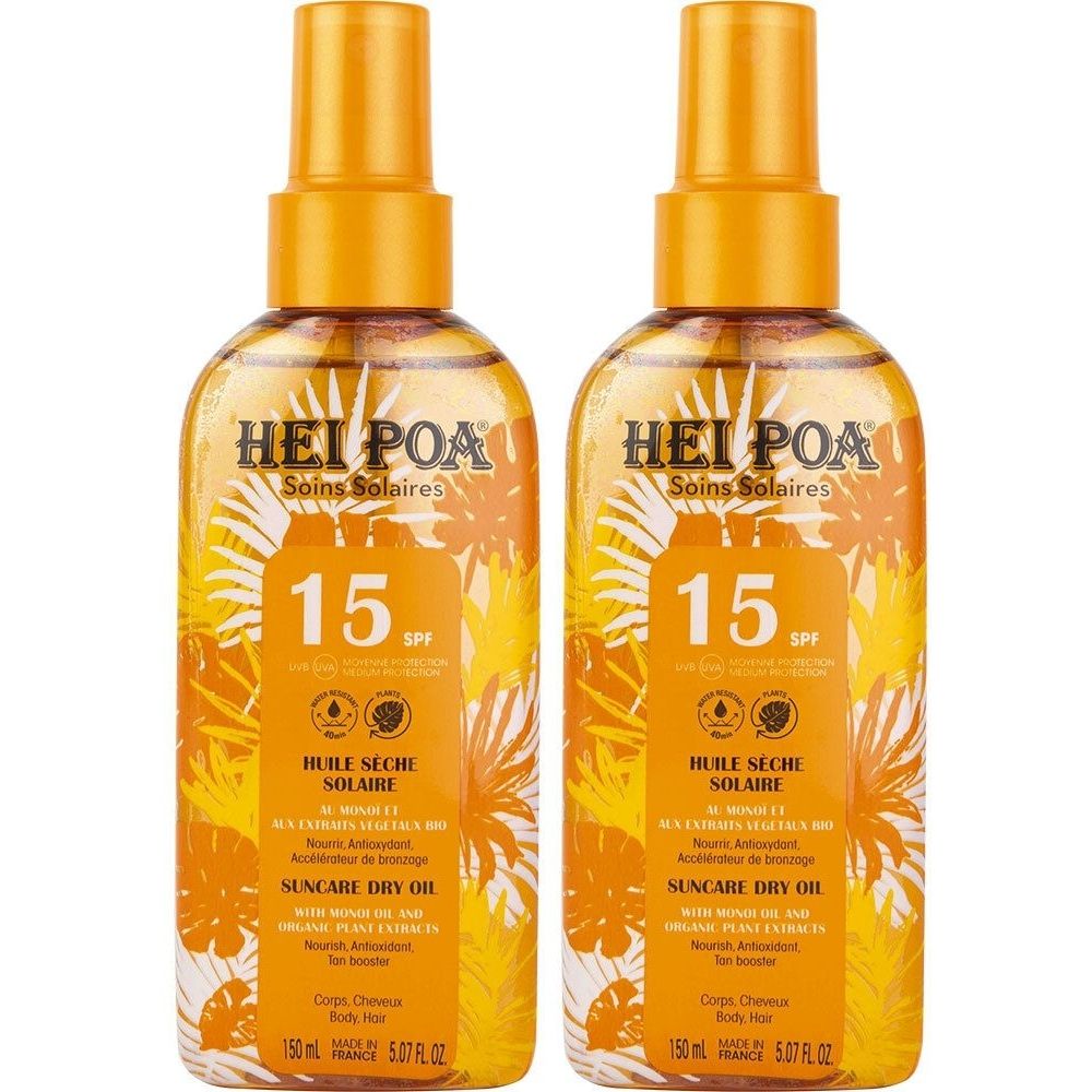 Deux flacons d'huile solaire HEI POA SPF15. Flacons pulvérisateurs orange avec étiquette jaune et informations sur le produit. Inscription : Huile Sèche Solaire.