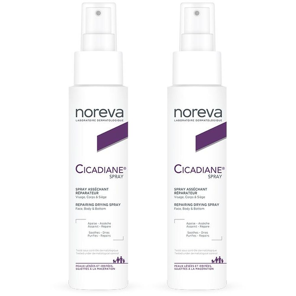 Deux flacons spray blancs avec accents violets. Inscription: Noreva Cicadiane Spray. Spray asséchant réparateur pour visage, corps.