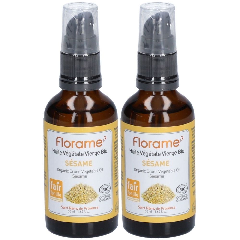 Twee bruine glazen flessen met zwarte pomp. Labels: "Florame Huile Végétale Vierge Bio SÉSAME". BIO en Fair for Life certificeringen.