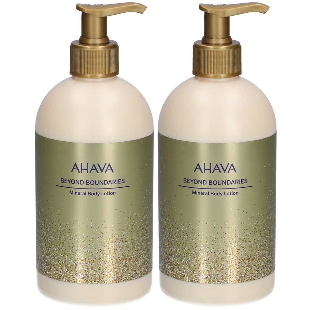 Deux flacons de lotion avec pompes dorées. Inscription: AHAVA Beyond Boundaries Mineral Body Lotion. Étiquette beige et dorée.