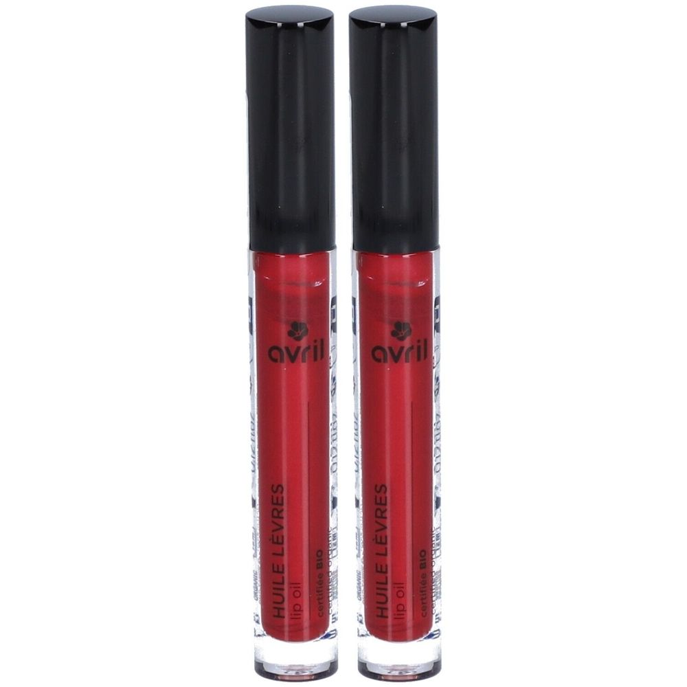 Twee lipgloss tubes met zwarte doppen. Rood vloeistof zichtbaar. Opschrift: avril, Huile Lèvres, Bio.