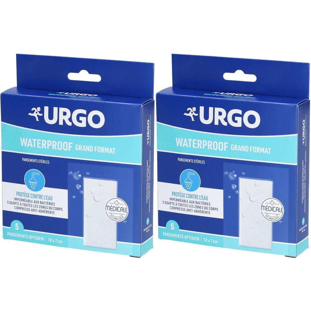 Twee blauwe dozen met Urgo-pleisters. Opschrift: WATERPROOF GRAND FORMAT. Steriele pleisters zichtbaar. Medisch product.