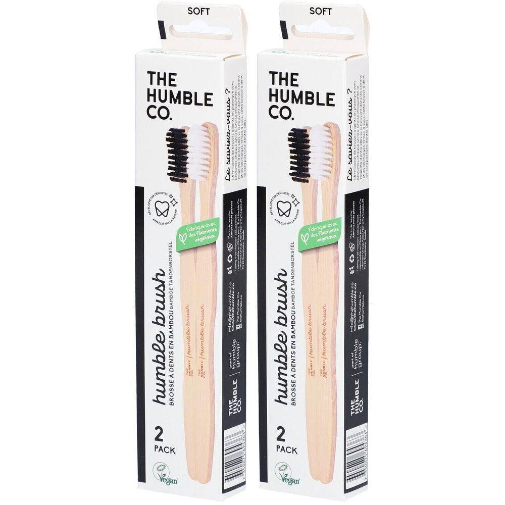 Twee tandenborstels in verpakking. Merk: The Humble Co. Opschrift: Humble brush, 2 Pack. Borstelharen: zwart en wit. Verpakking: wit.