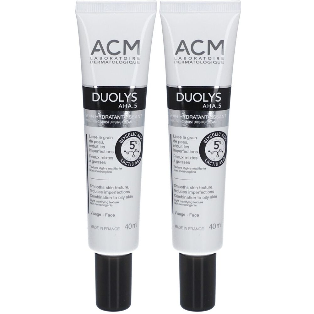Twee tubes ACM Duolys AHA.5. Witte tubes met zwarte tekst. Bevat glycolzuur en melkzuur. Voor de gemengde tot vette huid.