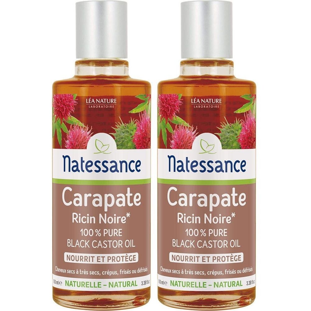 Deux flacons d'huile Natessance Carapate. Inscription: Ricin Noire, 100% Pure Black Castor Oil. Design floral, bouchon argenté.