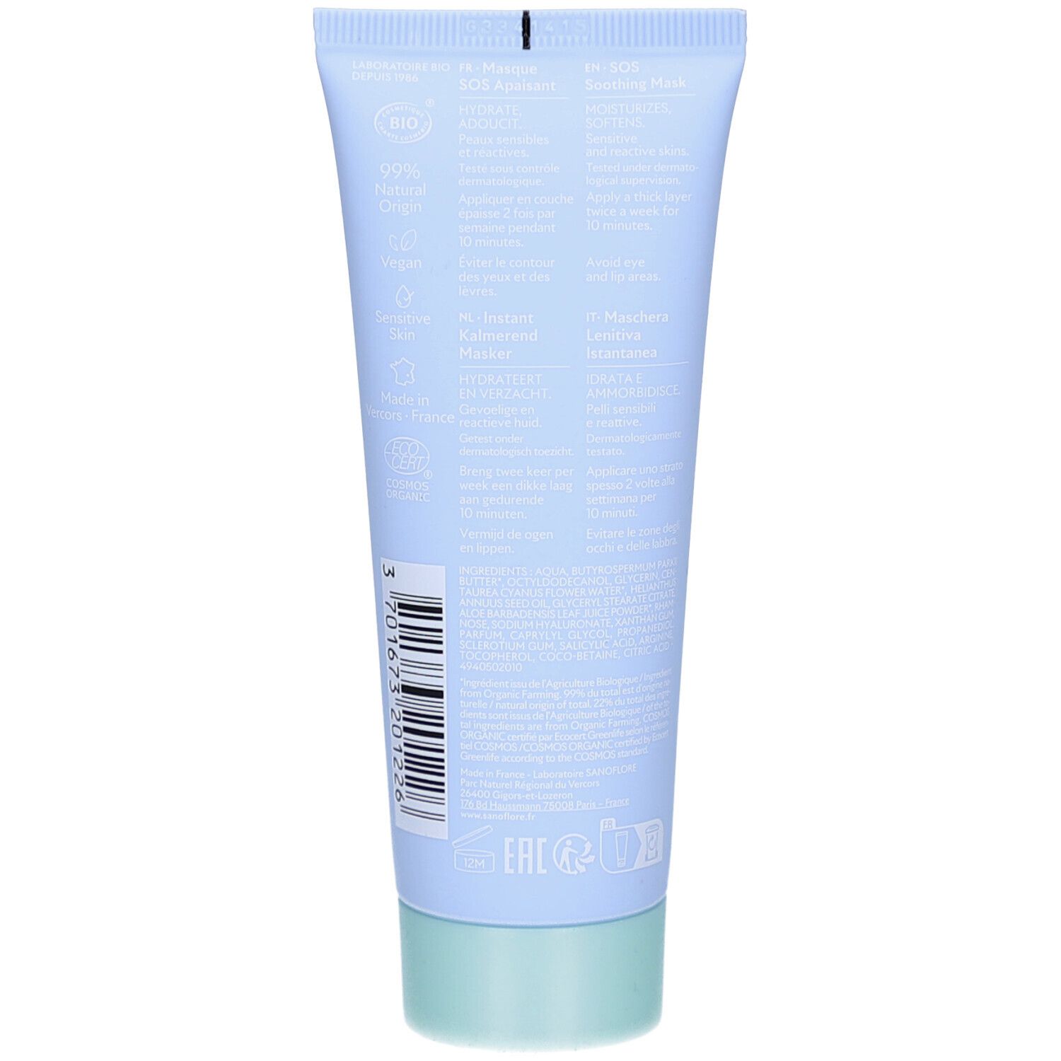 Achterkant van de lichtblauwe tube. Tekst in meerdere talen. Groene dop. Barcode en bio-certificering.