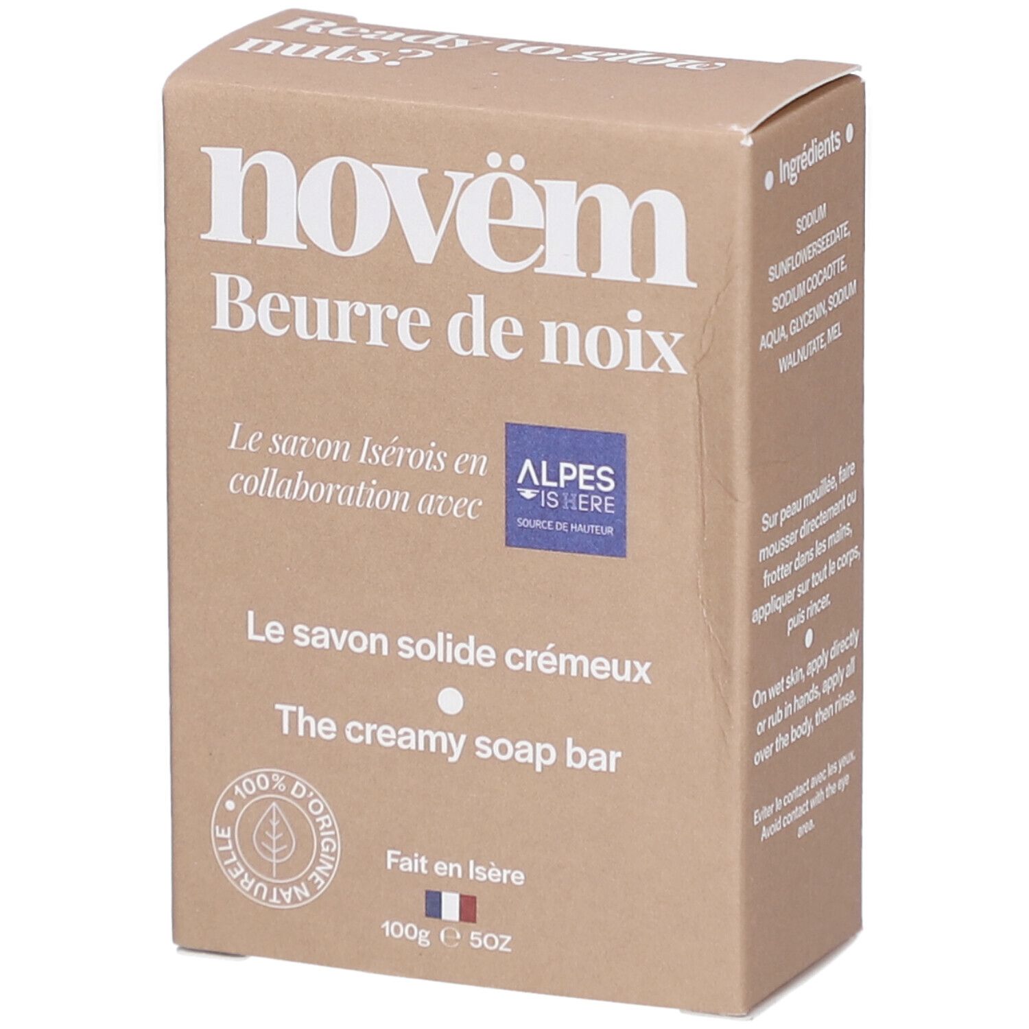 Bruine kartonnen verpakking met productinformatie. Opschrift: novëm, Beurre de noix, Le savon solide crémeux, The creamy soap bar. Met logo.