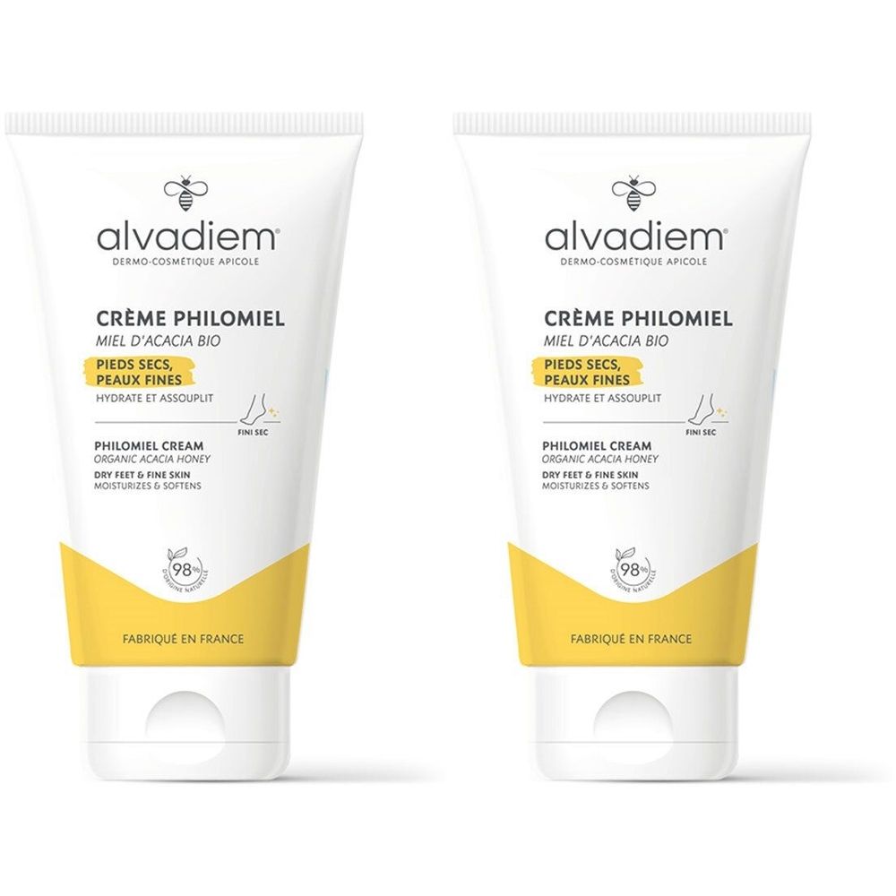 Twee tubes Alvadiem Philomiel voetcrème met honing voor droge voeten. Witte tubes met gele accenten en bijenlogo.