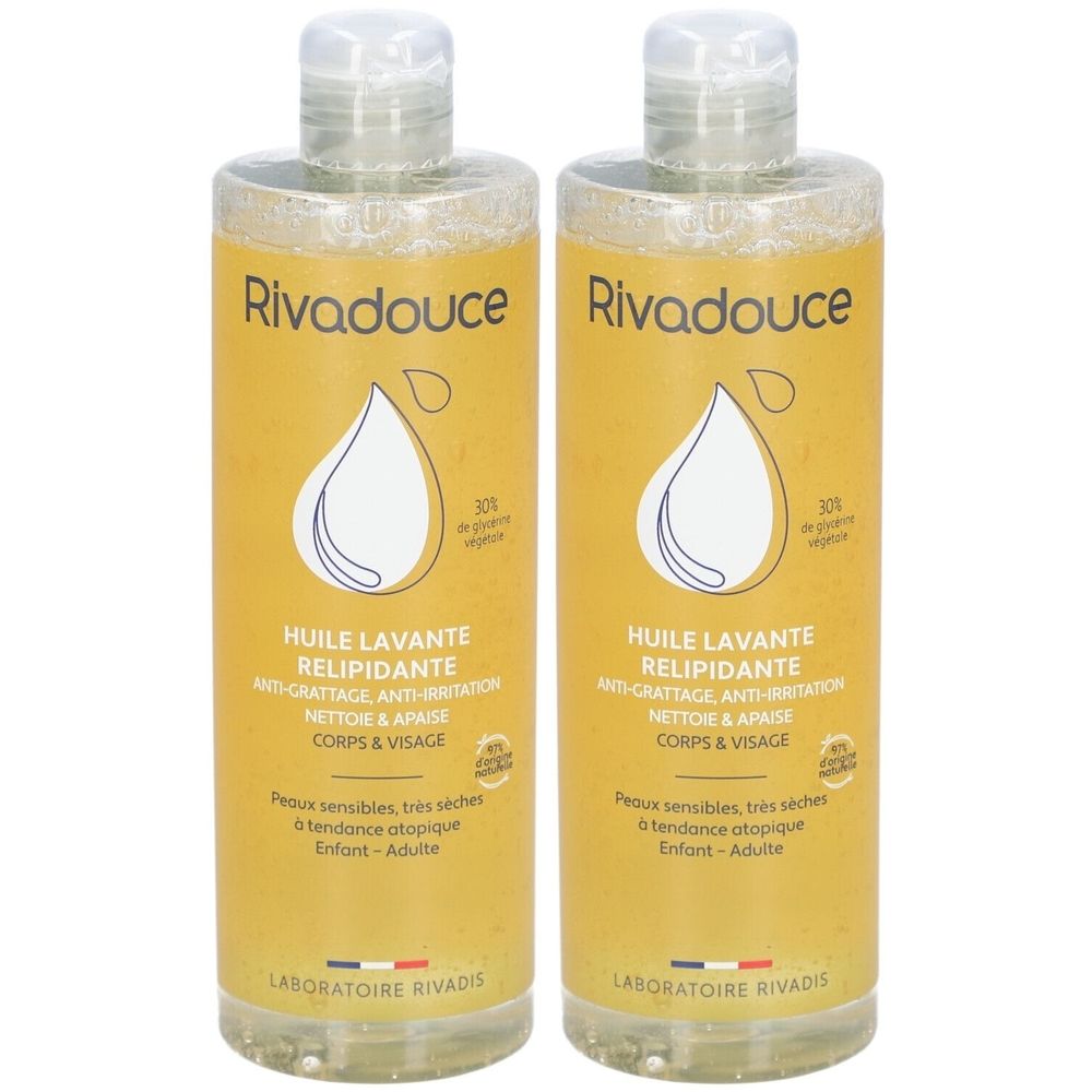 Deux flacons de Rivadouce Huile Lavante Relipidante. Liquide jaune, bouchon blanc. Inscription : Huile Lavante, Anti-irritation, pour corps et visage.