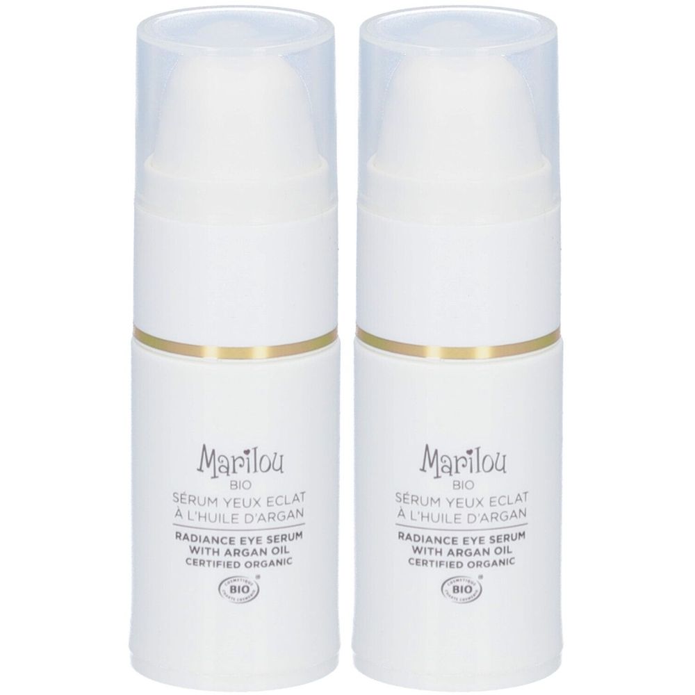 Twee witte flacons met gouden ringen en transparante doppen. Opschrift: Marilou, Sérum Yeux Eclat, met arganolie, bio-certificering.