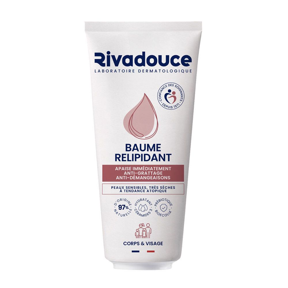 Witte tube met Rivadouce-logo en productnaam. Roze druppelsymbool. Tekst: Baume Relipidant, anti-jeuk, voor gevoelige, zeer droge huid.