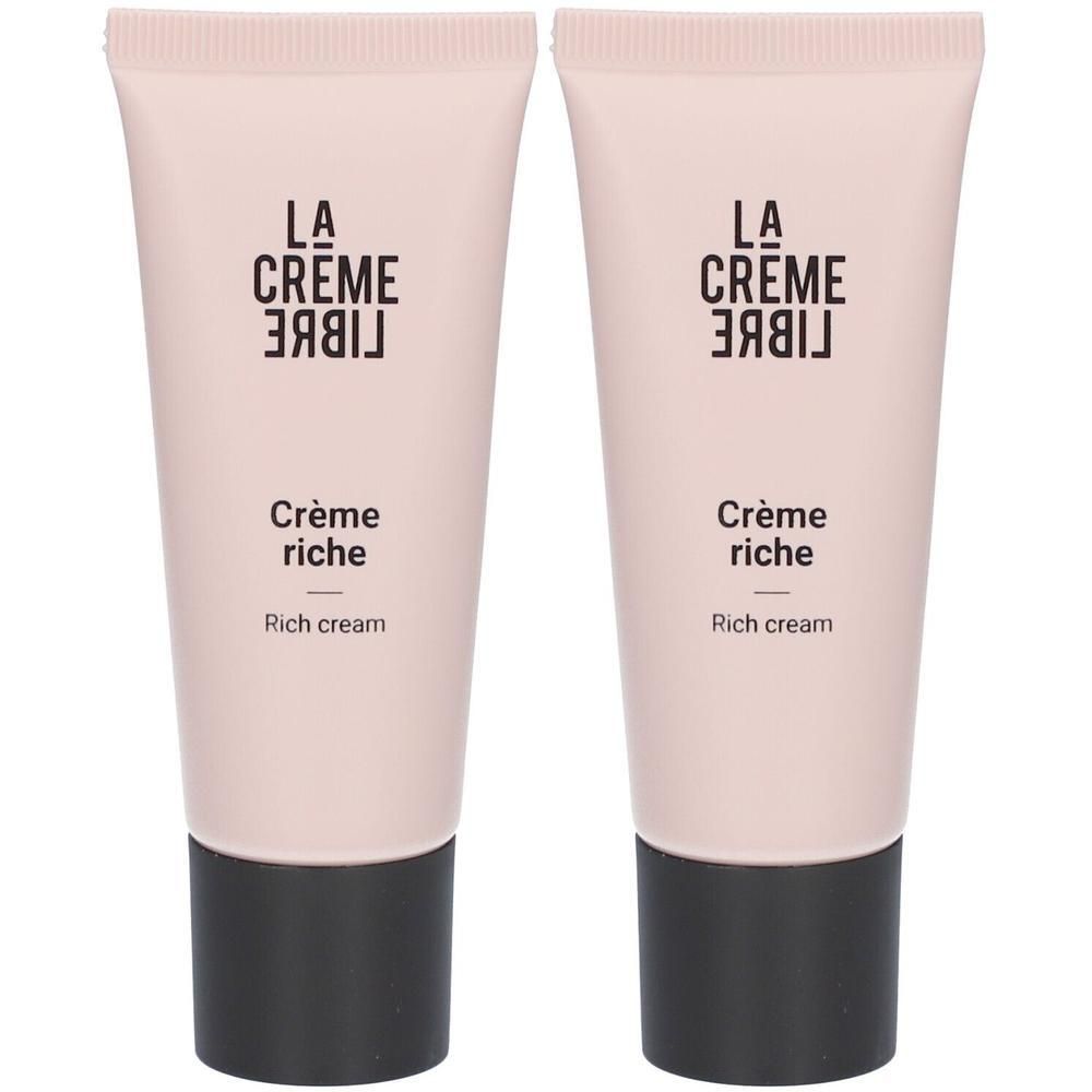 Twee crèmetubes. Lichtroze tubes met zwarte dop. Opschrift: La Crème Libre, Crème riche, Rich cream.