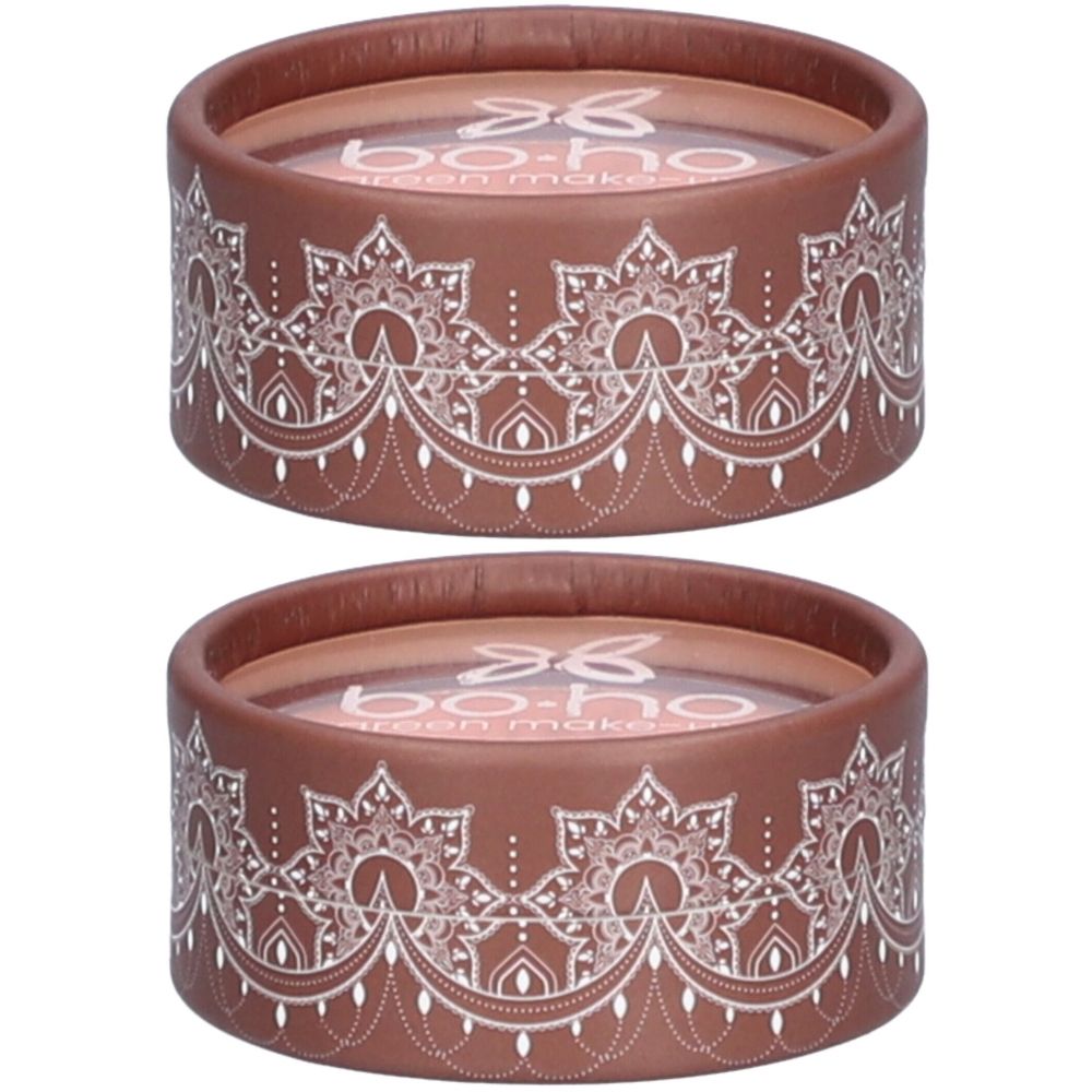 Twee ronde containers. Bruine behuizing met wit patroon. Opschrift: bo-ho green make-up. Roze binnenkant.