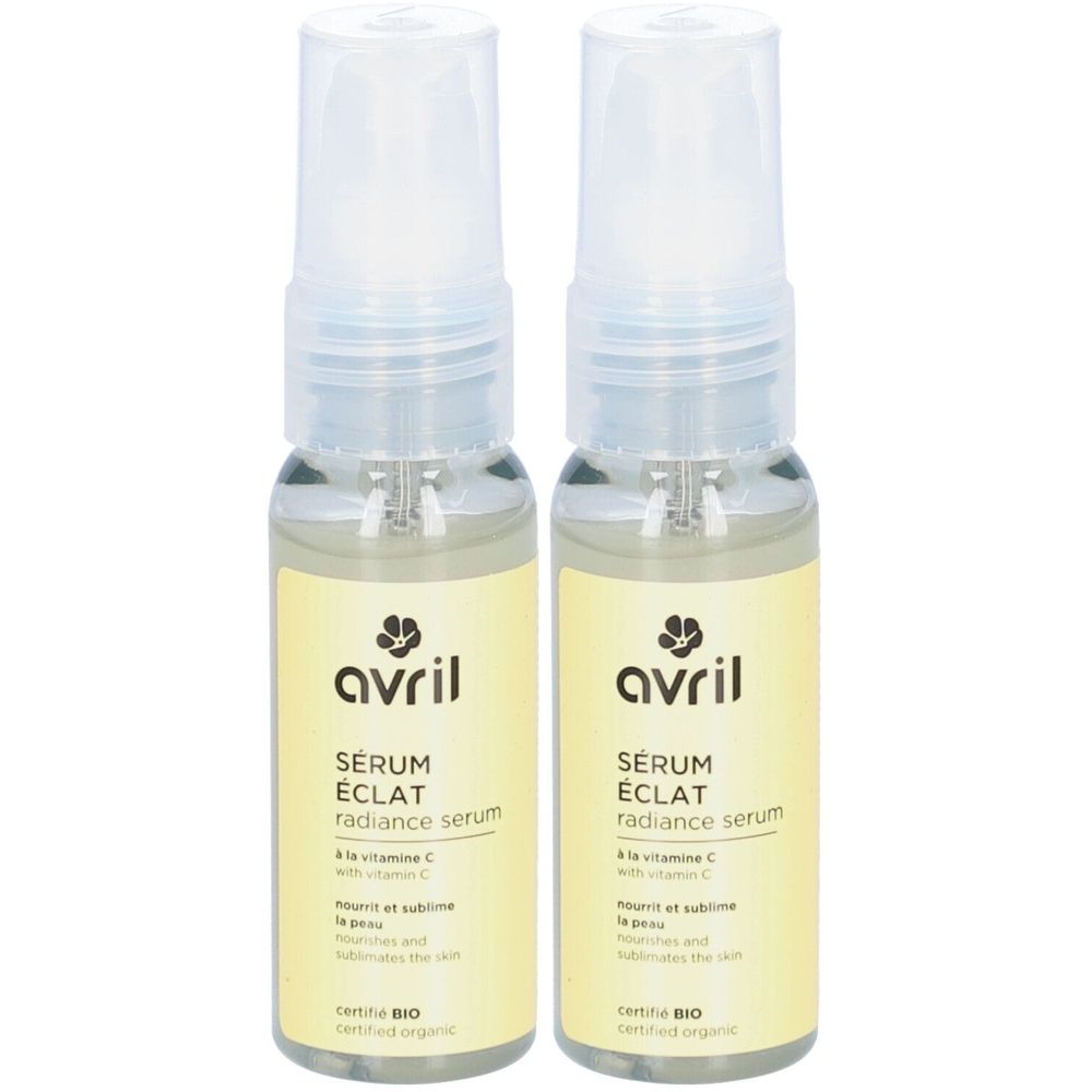 Twee flacons AVRIL Sérum Eclat. Heldere vloeistof in glazen flacons met verstuiver. Geel etiket met tekst en logo.