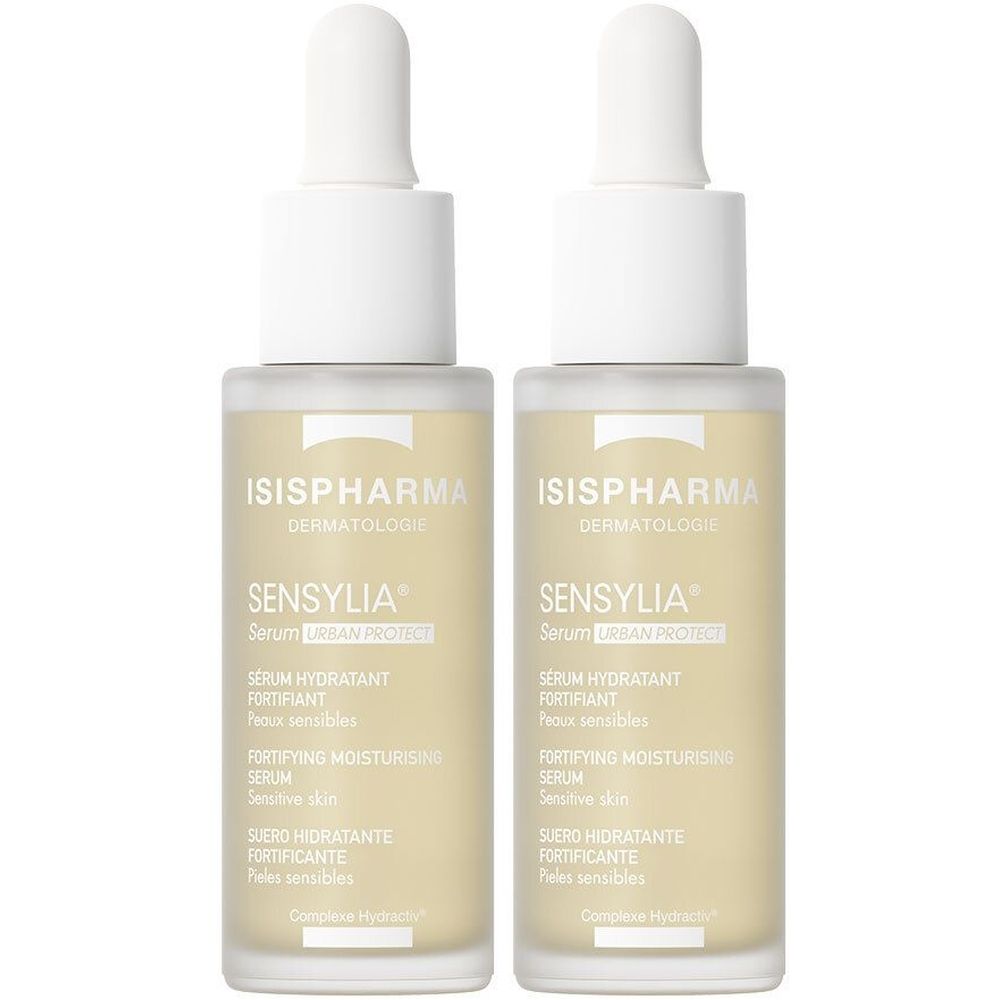 Twee flacons ISISPHARMA Sensylia Serum Urban Protect. Beige glazen flacons met witte dop en pipet. Tekst op etiket.