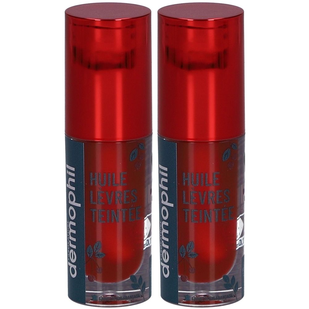 Twee lippenoliën met rode dop. Opschrift: dermophil, Huile Lèvres Teintée. Transparante flacons met rode vloeistof.
