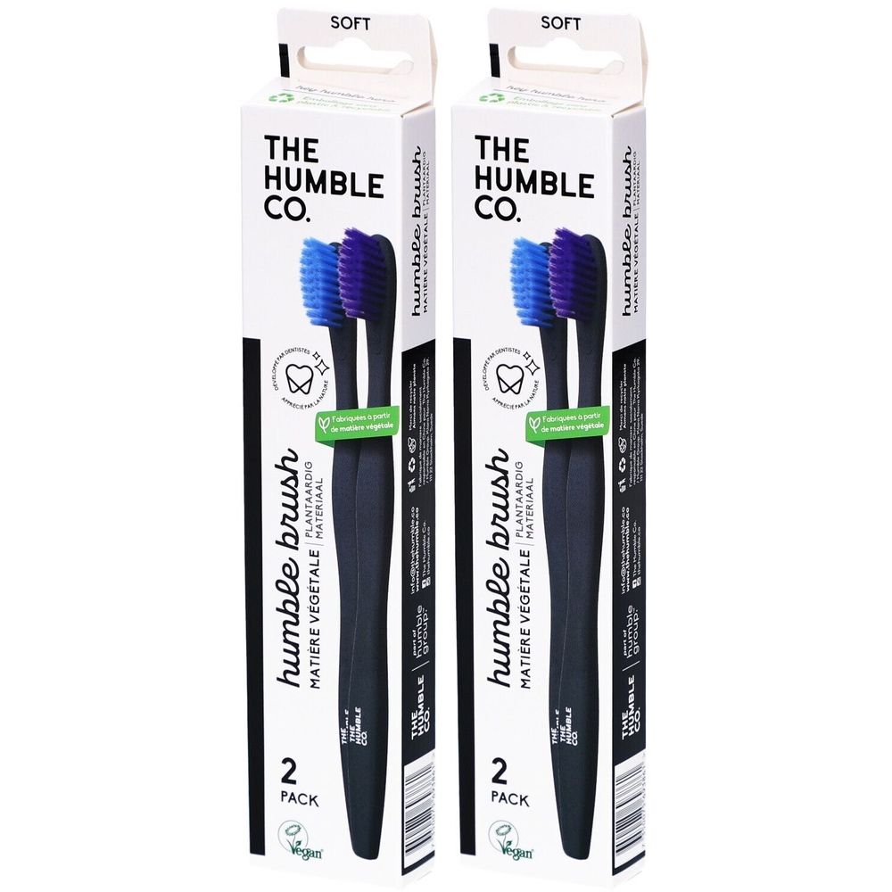 Deux brosses à dents dans un emballage. Manches noirs, soies bleues et violettes. Inscription : THE HUMBLE CO. et humble brush.