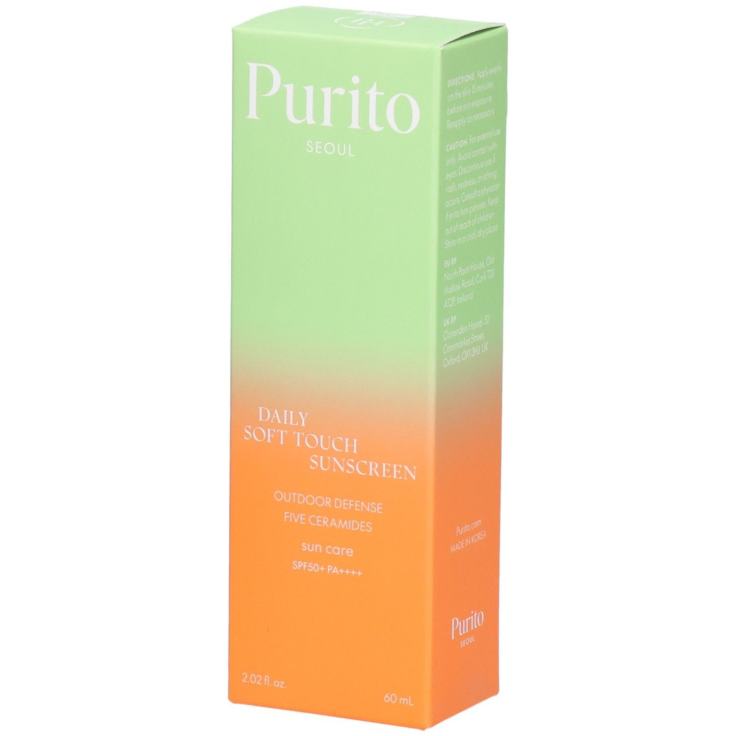 Boîte verte et orange avec informations produit. Texte: Purito, Daily Soft Touch Sunscreen, SPF 50+ PA++++.