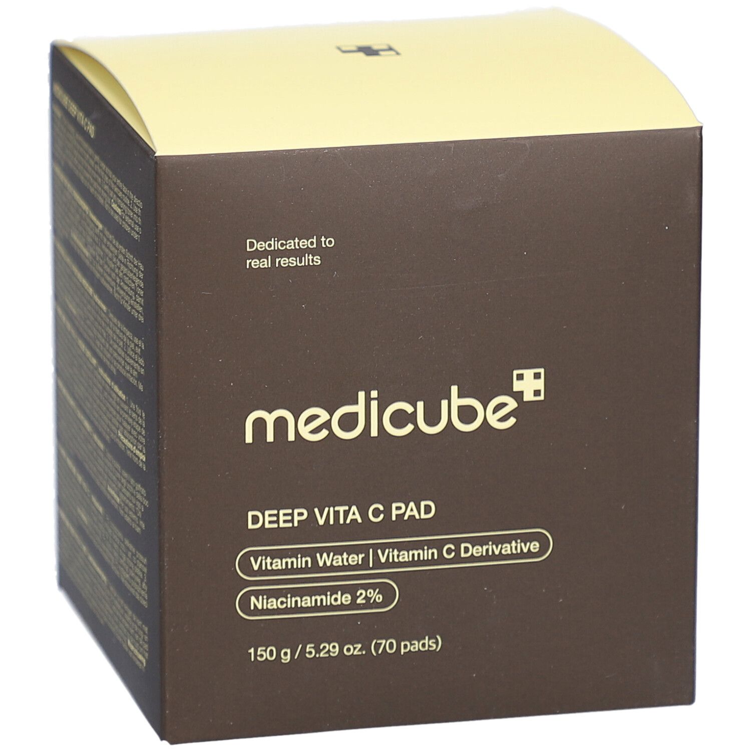Bruine doos met gele deksel. Opschrift: medicube, DEEP VITA C PAD, Vitamin Water, Vitamin C Derivative, Niacinamide 2%.
