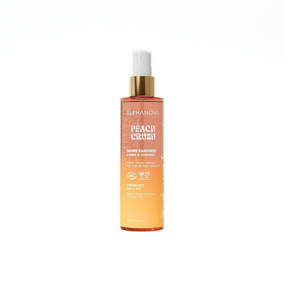 Body- en haarspray. Fles met verstuiver. Oranje naar gele kleurverloop. Tekst: Peach Crush, Alphanova.