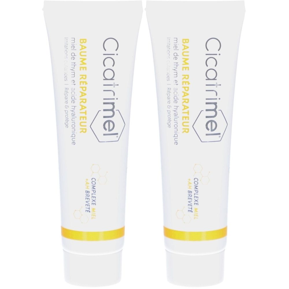Deux tubes de Baume Réparateur Cicatrimel. Contient du miel de thym et de l'acide hyaluronique. Inscription en noir sur fond blanc.