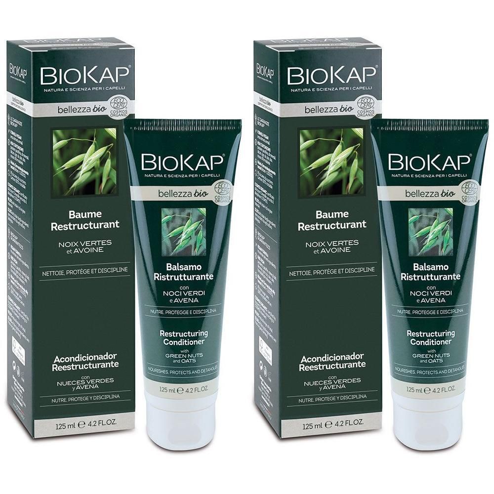 Deux tubes et boîtes vertes. Inscription: BIOKAP Baume Restructurant. Avec avoine et noix vertes. 125 ml.
