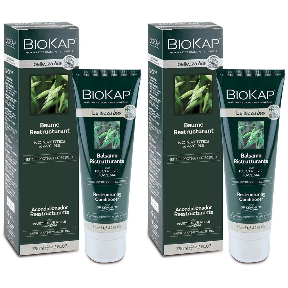 Twee groene tubes en dozen. Opschrift: BIOKAP Baume Restructurant. Met haver en groene noten. 125 ml.