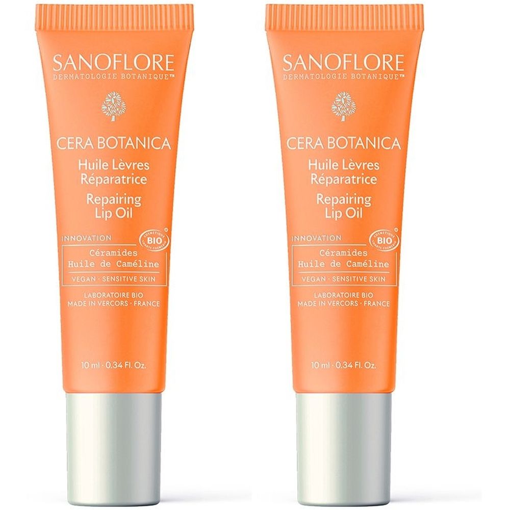 Deux tubes de SANOFLORE Cera Botanica Huile Lèvres Réparatrice. Tubes oranges avec bouchons argentés. Texte: Repairing Lip Oil, BIO.