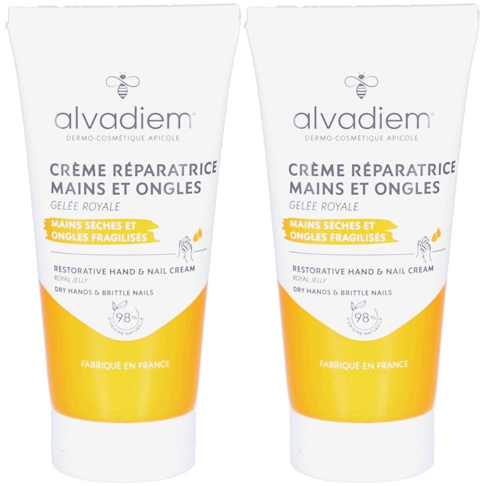 Twee tubes hand- en nagelcrème. Wit, met gele accenten. Tekst: Crème Réparatrice Mains et Ongles, Alvadiem.