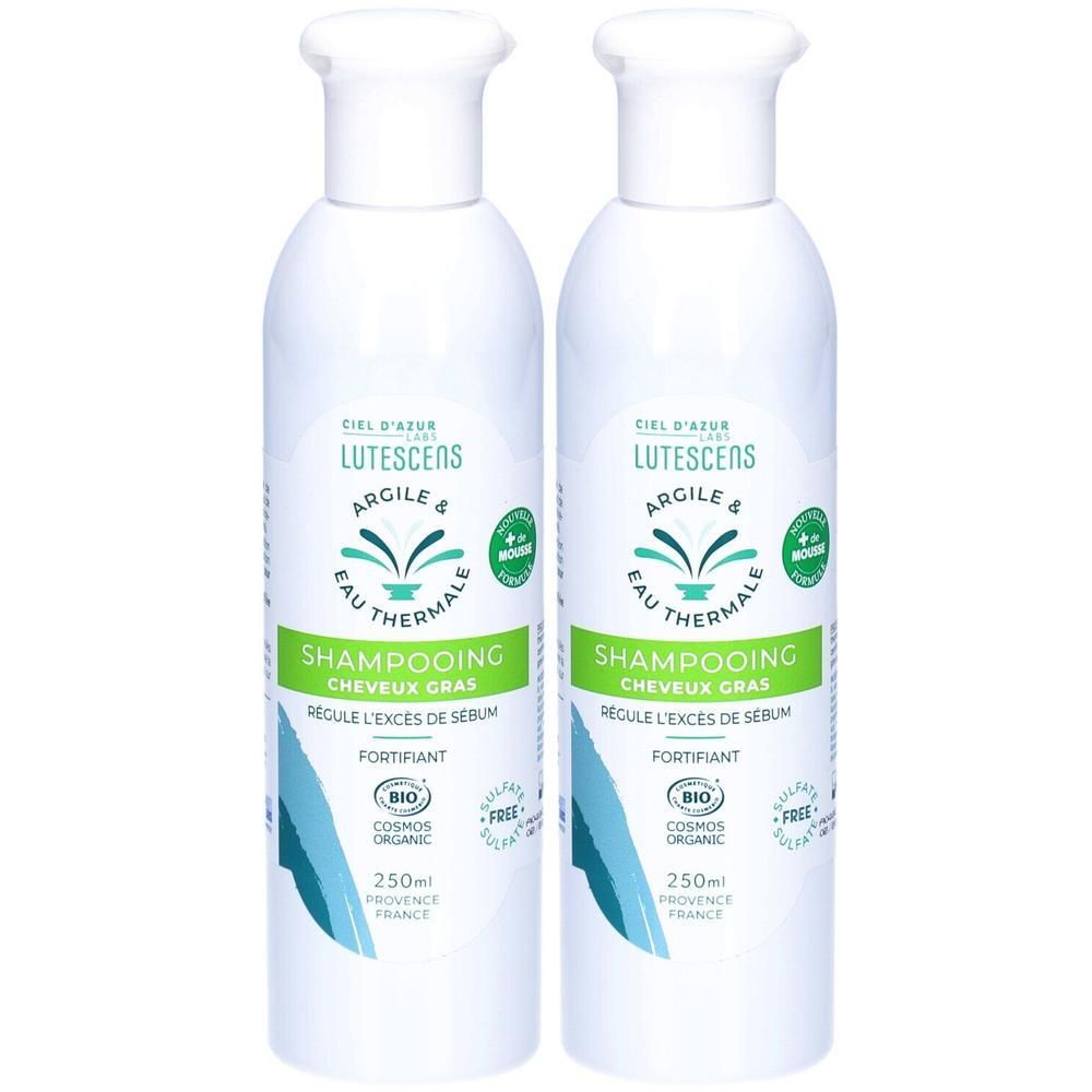 Twee witte shampoo flessen. Opschrift: Lutescens, Argile & Eau Thermale. Groen: Shampooing Cheveux Gras. Bio-certificering.