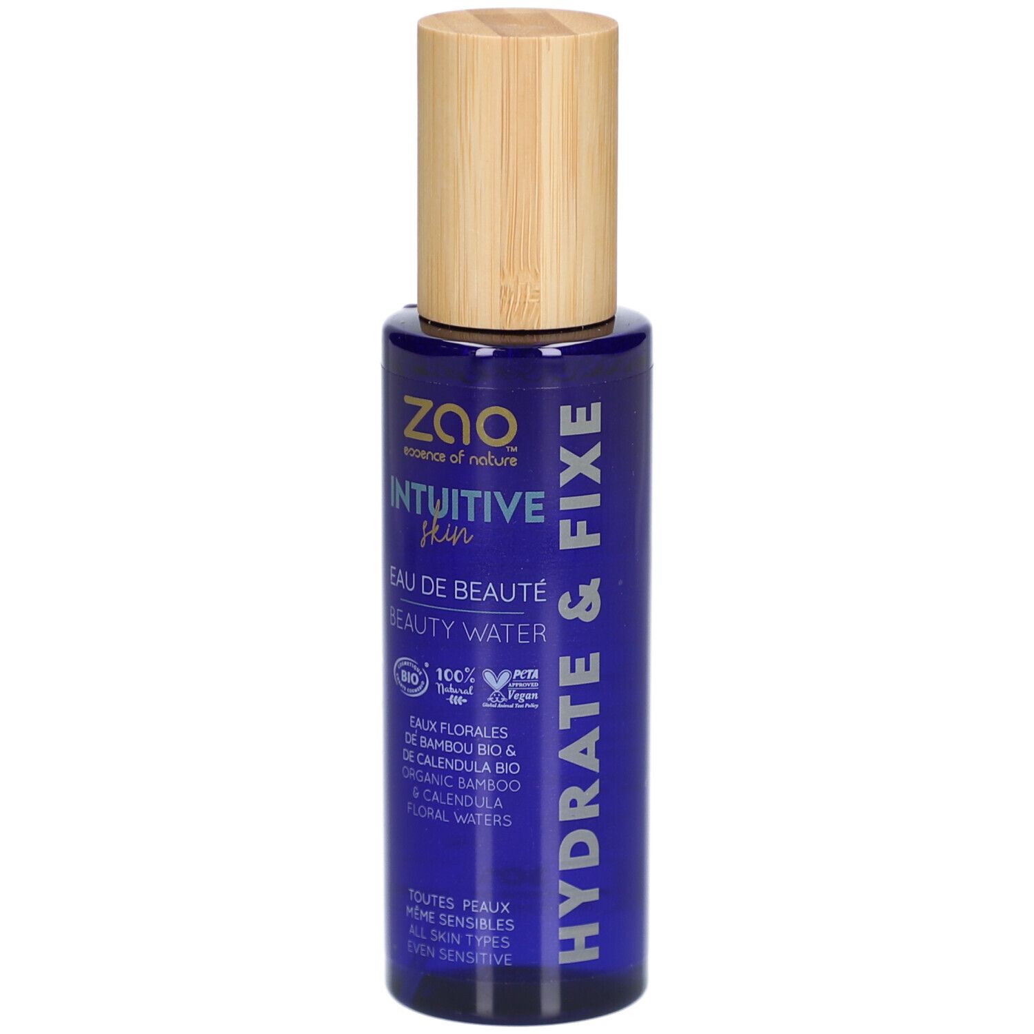 Flacon bleu avec bouchon en bois. Inscription : ZAO, Intuitive Skin, Eau de Beauté, Beauty Water. Hydrate & Fixe.