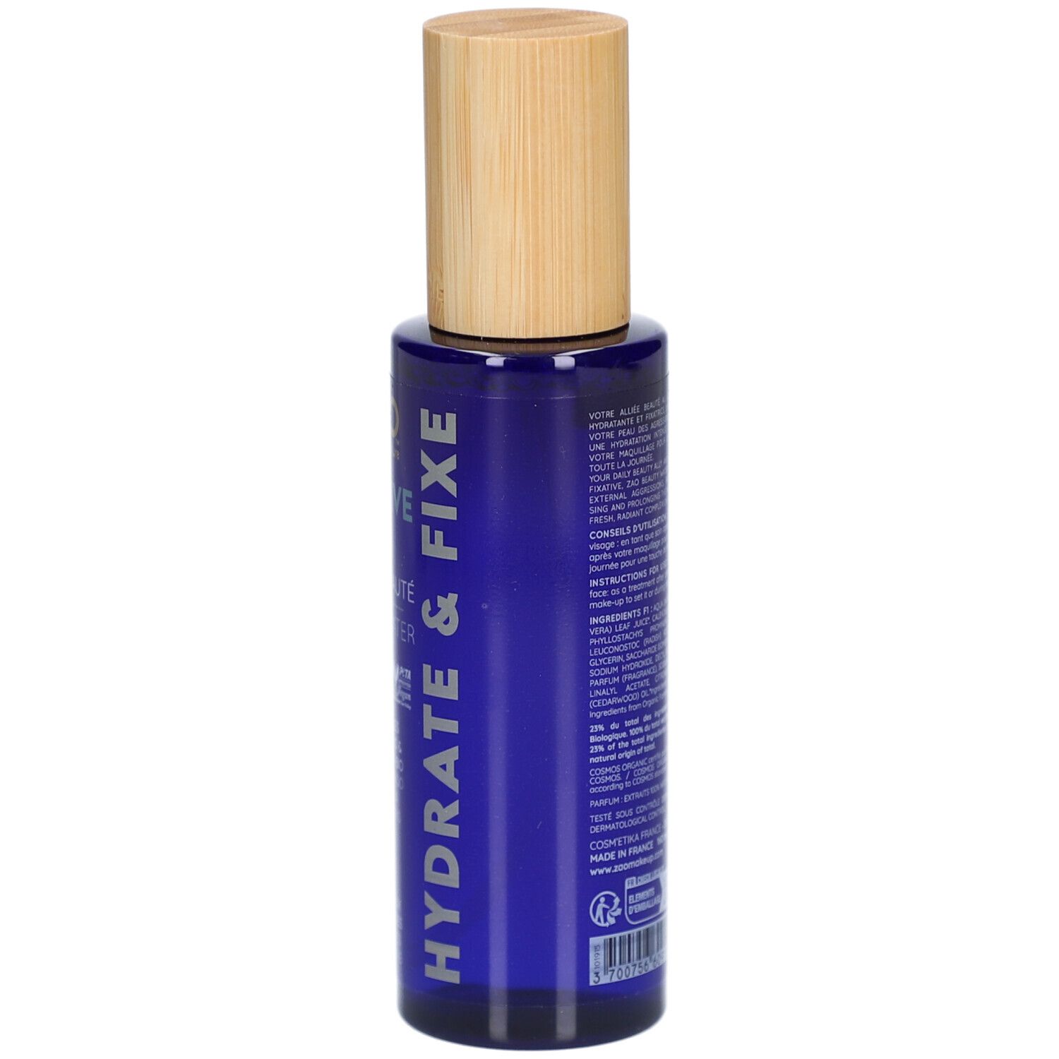 Dos d'un flacon bleu avec bouchon en bois. Texte : ingrédients, mode d'emploi, informations fabricant.