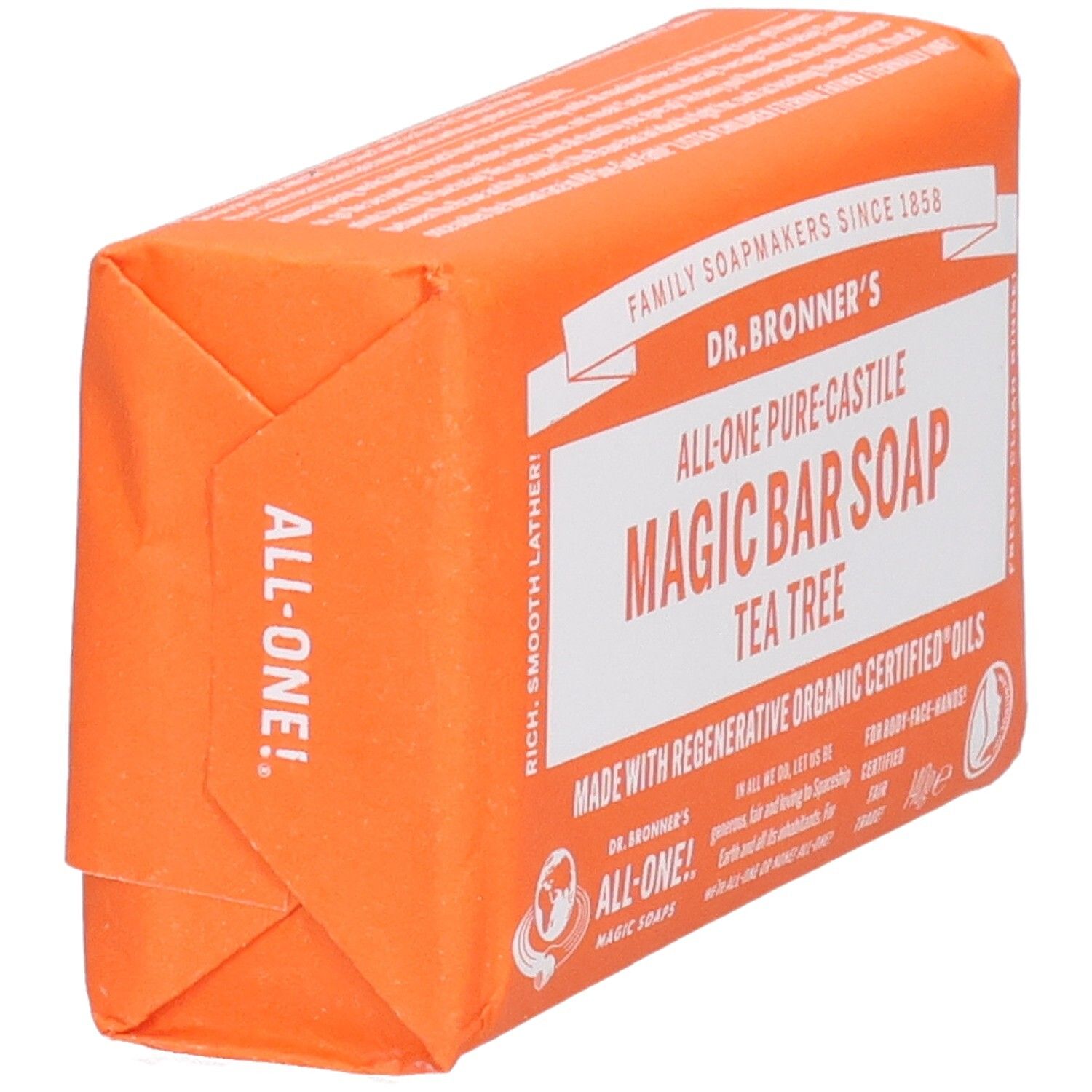 Oranje zeep in papieren verpakking. Opschrift: Magic Bar Soap Tea Tree. Bovenaanzicht.