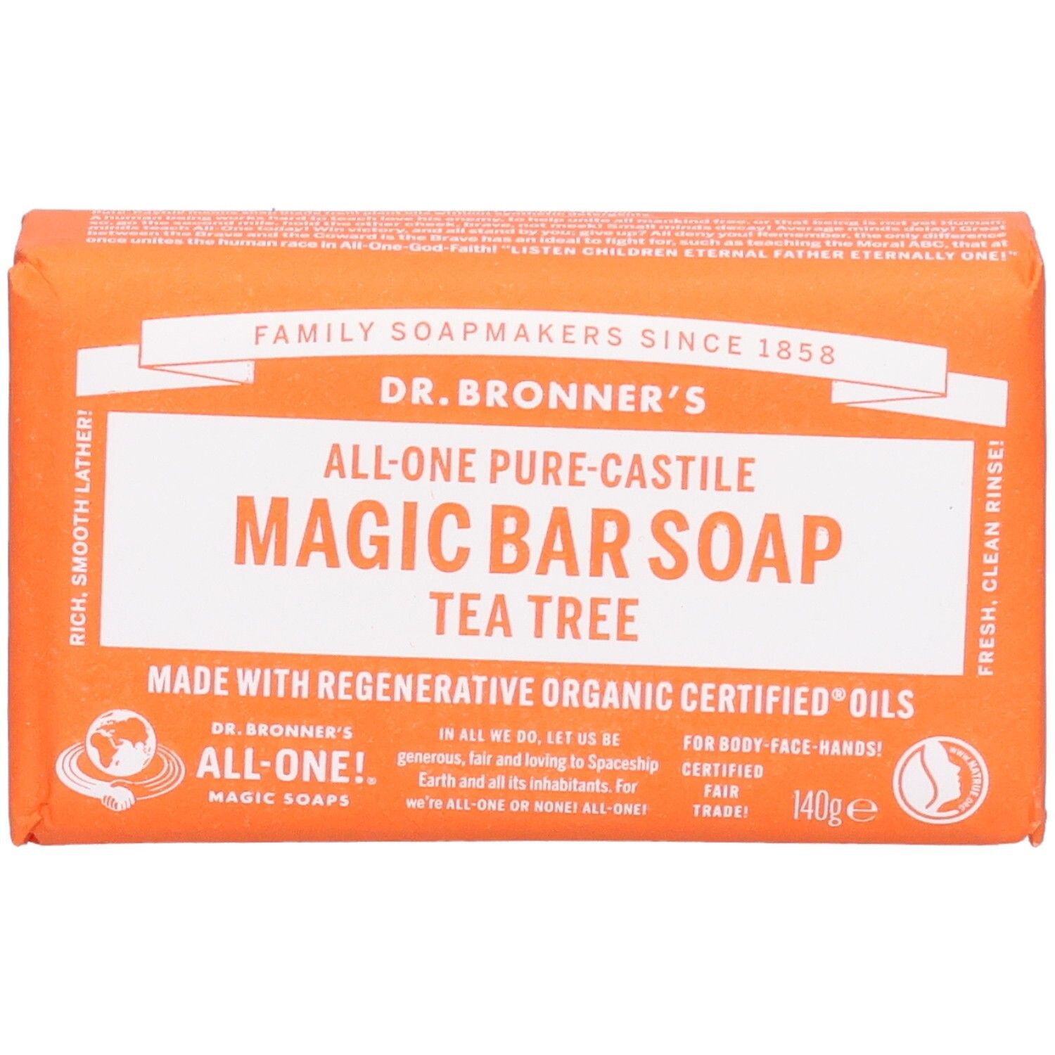 Oranje zeep in papieren verpakking. Opschrift: Magic Bar Soap Tea Tree. Fair Trade-label.