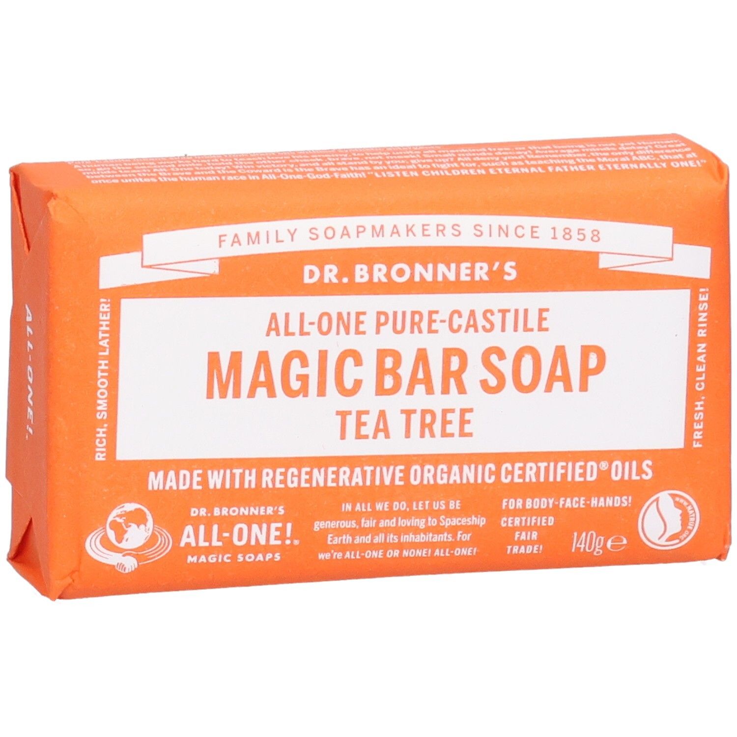 Oranje zeep in papieren verpakking. Opschrift: Magic Bar Soap Tea Tree. Fair Trade-label.