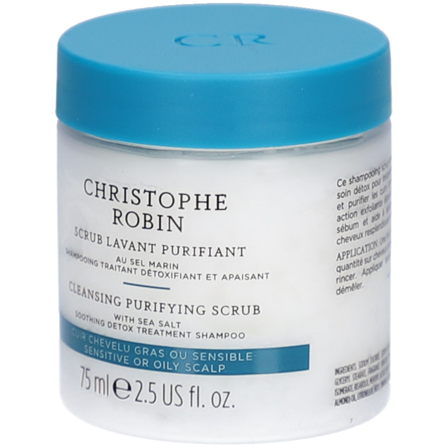 Witte pot met blauwe deksel. Opschrift: CHRISTOPHE ROBIN, SCRUB LAVANT PURIFIANT, CLEANSING PURIFYING SCRUB. Voor vette of gevoelige hoofdhuid.