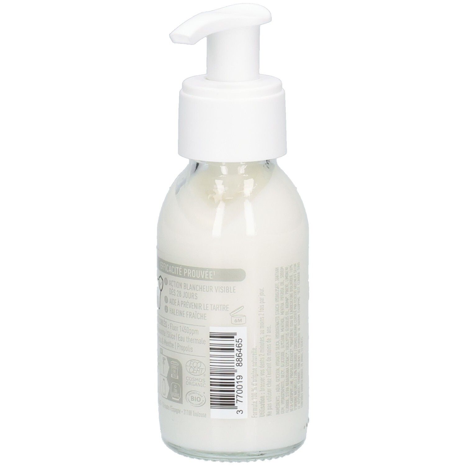 Glazen fles met witte inhoud en pomp. Achterkant met tekst en barcode. Etiketten met informatie.